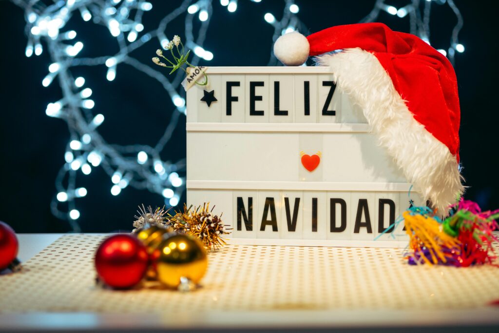 Festive Feliz Navidad lightbox with red Santa hat and Christmas ornaments, perfect for holiday celebrations.